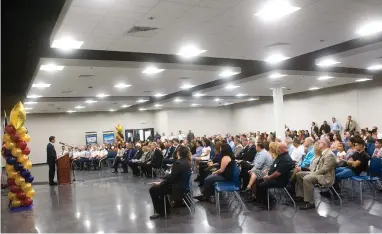  ?? RECORDER PHOTOS BY CHIEKO HARA ?? PUSD Superinten­dent Nate Nelson (above, at podium) addressed a large audience Wednesday, Aug. 8, at the ribbon cutting ceremony of the Portervill­e Military Academy after cadet color guard (right) presented the colors for the ceremony.