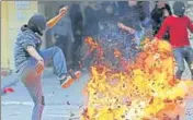  ?? REUTERS ?? ■
A protester reacts next to a fire during a demonstrat­ion against the Middle East peace plan, in Hebron, West Bank.