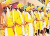  ??  ?? ■ The ceremonial Panj Piare, the five loved ones of the guru, lead a group of pilgrims headed for Hemkunt Sahib, at Govindghat on Thursday. RAJEEV KALA/HT