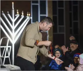  ?? BEN HASTY — MEDIANEWS GROUP ?? Magician Joshua Jay performs magic tricks as part of his presentati­on. During the Magical Chanukah event, with magician Joshua Jay, at Chabad-Lubavitch of Berks County Wednesday evening, Dec. 1.