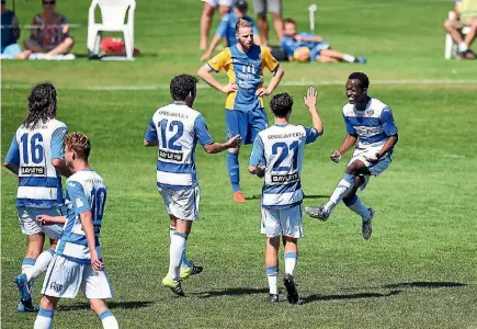  ?? CHRIS SYMES/PHOTOSPORT ?? Tasman forward Tinashe Marowa, right, celebrates with team-mates after scoring against Southern last season.