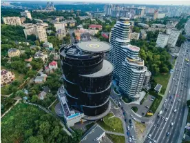  ?? ?? Choppers away ... the mirrored Kyiv tower by Svitlana Zdorenko. Photograph: A Pashenko Architects