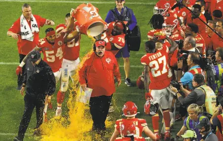  ?? Mike Ehrmann / Getty Images ?? Andy Reid gets the winning coach’s Gatorade shower. Reid went to the Super Bowl once before as a head coach, with the Eagles.
