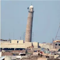  ??  ?? A flag of terrorist group daesh is seen on top of Mosul’s Al Hadba minaret at the Grand Mosque, where the terror outfit’s leader Abu Bakr Al Baghdadi declared his caliphate back in 2014; and, right, an image provided by US CENTCOM shows Al Nuri mosque destroyed by Daesh in Mosul on Wednesday. —