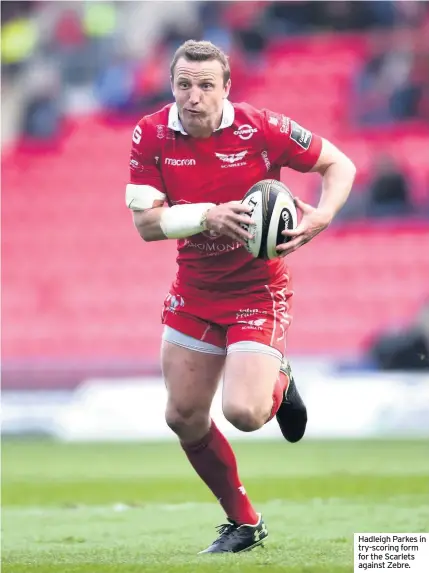  ??  ?? Hadleigh Parkes in try-scoring form for the Scarlets against Zebre.