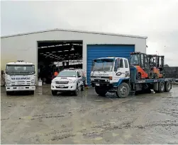  ??  ?? AB Equiopment’s workshop and some of their trucks.