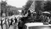  ?? PHOTO: AP ?? Taliban fighters display their flag while on patrol