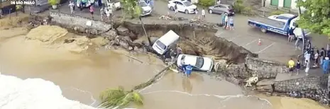  ?? AP ?? Photo provided by the Sao Paulo government shows vehicles fallen from an elevated area along the beach in Sao Sebastiao City on Sunday after it was damaged by a severe weather system that went through the area.