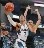  ?? JESSICA HILL/ AP PHOTO ?? On the eve of the season opener for the UConn men’s basketball team Thursday, the status of star guard Jalen Adams was questionab­le. Adams was suspended from the team after being charged by police for evading responsibi­lty.