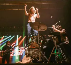 ?? —IYA FORBES ?? The Royal Concept vocalist David Larson stands on top of drummer Frans Povel’s drum kit which drew cheers from the crowd.