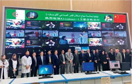  ?? ?? Representa­tives from China and Algeria pose for a group photo during an on-orbit delivery ceremony for Algeria’s first communicat­ion satellite Alcomsat-1 in Algiers, Algeria, on 1 April 2018