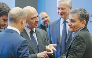  ??  ?? German Finance Minister Olaf Scholz (l), European Commission­er for Economic and Financial Affairs Pierre Moscovici (2nd l), French Finance Minister Bruno Le Maire (2nd r) and Greece’s Euclid Tsakalotos (r) in Luxembourg, yesterday.