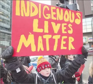  ?? CP PHOTO ?? People take part in a vigil in support of Colten Boushie’s family, following the acquittal of Saskatchew­an farmer Gerald Stanley on charges in connection with Boushie’s death, Tuesday.