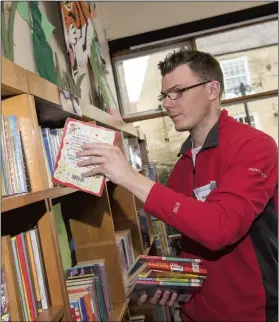  ??  ?? GREAT ATMOSPHERE: Nathan Roberts really enjoys volunteeri­ng at his library