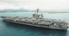  ?? Petty Officer 3rd Class Jessica Blackwell / Navy Public Affairs Support Element Detachment Hawaii 2018 ?? The aircraft carrier Theodore Roosevelt arrives at Pearl Harbor in 2018. About 1,000 sailors have been removed from the ship, with 1,700 more expected to exit soon.