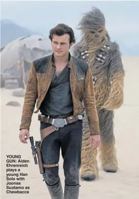  ??  ?? YOUNG GUN: Alden Ehrenreich plays a young Han Solo with Joonas Suotamo as Chewbacca