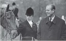  ??  ?? Easy company: The Duke of Edinburgh and Princess Anne, who shared a love of outdoor pursuits, are pictured at the 1971 Badminton Horse Trials