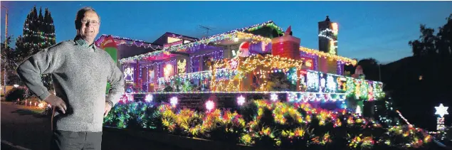 ?? PHOTO: STEPHEN JAQUIERY ?? Light ’em up . . . Months of planning and at least three or four weeks of work goes into the elaborate and colourful Christmas display outside John and Isabel Fraser’s home in Fairfield. The Frasers are just one of dozens of home owners in Dunedin lighting up the night with large outside Christmas displays this year.