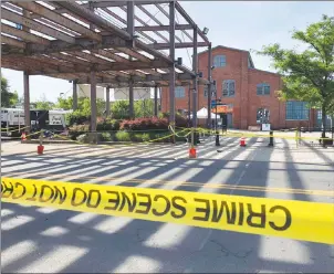 ?? AP PHOTO ?? Police crime scene tape keeps people away from the brick Roebling Wire Works building in Trenton, N.J., hours after a shooting broke out there at an all-night art festival early Sunday.