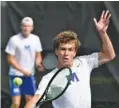  ?? ?? McCallie’s Colin Tuttle hits a shot at the net while doubles partner Andreas Sillaste looks on Wednesday.