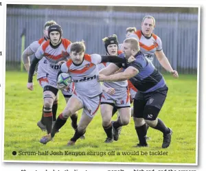  ??  ?? Scrum-half Josh Kenyon shrugs off a would be tackler