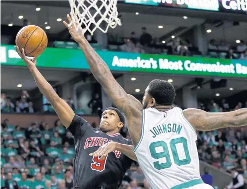  ?? USA TODAY SPORTS ?? The Bulls’ Rajon Rondo, left, is defended by the Celtics’ Amir Johnson at TD Garden in Boston.