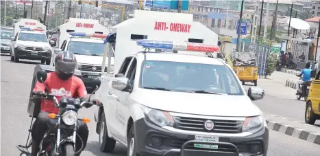  ?? Photo: Benedict Uwalaka. ?? Anti-One Way Police Patrol personnel vehicles on duty at Awolowo, Ikeja in Lagos.