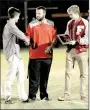  ?? MARK HUMPHREY ENTERPRISE-LEADER ?? Farmington tennis coach Denver Holt (center) shakes hands with senior Coleman Warren while senior Payton Maxwell eyes the pair’s 5A West doubles championsh­ip trophy.