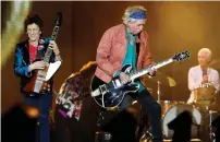  ?? (Reuters) ?? KEITH RICHARDS, Ron Wood and Charlie Watts of the Rolling Stones perform during a concert of their ‘No Filter’ European tour at the Orange Velodrome stadium in Marseille in June.