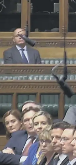  ??  ?? Boris Johnson gives his resignatio­n statement in the Commons yesterday. Theresa May, top right, takes a question from former Brexit minister David Davis, above, at Prime Minister’s Questions