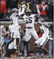  ?? CARLOS OSORIO — THE ASSOCIATED PRESS ?? Ohio State running back Mike Weber (25) celebrates with wide receiver Parris Campbell (21) and wide receiver Binjimen Victor (9) after Weber’s touchdown against Michigan on Nov. 25 in Ann Arbor, Mich. Ohio State won, 31-20.