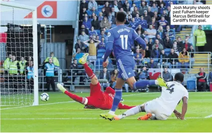  ??  ?? Josh Murphy shoots past Fulham keeper Marcus Bettinelli for Cardiff’s first goal.