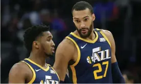  ??  ?? Donovan Mitchell, left, and his teammate Rudy Gobert have both been diagnosed with Covid-19. Photograph: Duane Burleson/AP