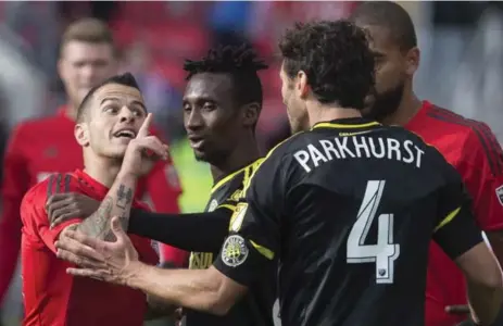  ?? CHRIS YOUNG/THE CANADIAN PRESS ?? Toronto FC’s Sebastian Giovinco exchanges unpleasant­ries with Columbus’s Michael Parkhurst at the final whistle Saturday afternoon at BMO Field.