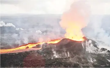  ?? — AFP photo ?? This image obtained from the US Geological Survey shows an early morning view of fissure 8 and lava channel looking toward the east.