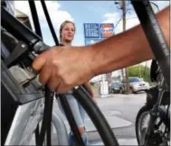  ?? DIGITAL FIRST MEDIA FILE PHOTO ?? Customers pump gas at a Gulf Service Station in York County. Pennsylvan­ia’s gas tax, already the highest in the nation, goes up 8 cents on Jan. 1