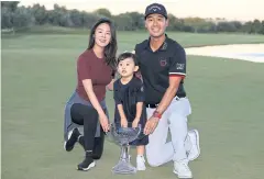  ?? AFP ?? Kevin Na poses with the trophy and his family after his win in Las Vegas.