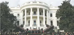  ?? ASSOCIATED PRESS FILE PHOTO ?? President Donald Trump, with members of Congress and supporters, speaks Dec. 20 on the South Lawn of the White House in Washington, after passage of the tax bill.