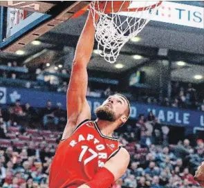  ?? TORONTO STAR FILE PHOTO ?? Jonas Valanciuna­s of the Raptors slams the ball during NBA action against the Charlotte Hornets at the Air Canada Centre in Toronto on Sunday.