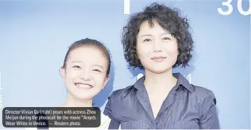  ?? — Reuters photo ?? Director Vivian Qu (right) poses with actress Zhou Meijun during the photocall for the movie “Angels Wear White in Venice.