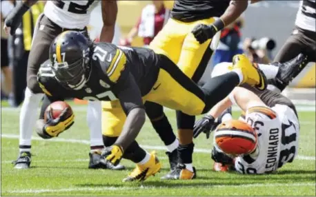  ?? THE ASSOCIATED PRESS FILE ?? LeGarrette This is just Blount of the Steelers plows over Cleveland Browns defensive back Jim Leonhard for a touchdown in 2014. the kind of thing Eagles coach Doug Pederson wants to see from the veteran running back.