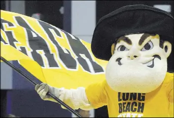  ?? Luis Sinco Los Angeles Times ?? Cal State Long Beach mascot Prospector Pete fires up the crowd before a basketball game at the university in Long Beach, Calif.