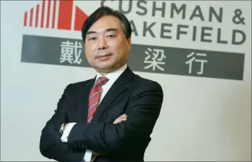  ?? PARKER ZHENG / CHINA DAILY ?? chief executive of Cushman & Wakefield Greater China Edward Cheung Kwok-ching, chief executive of Cushman & Wakefield Greater China, believes the company’s future will reach a new height by actively engaging itself in the country’s key developmen­t...