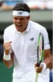  ?? JULIAN FINNEY/GETTY IMAGES ?? Milos Raonic won his opener at Wimbledon in straight sets over Germany’s Jan-Lennard Struff.