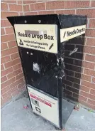  ??  ?? A needle disposal container outside the building at 241 Simcoe St., London, the site of one of the proposed injection sites.