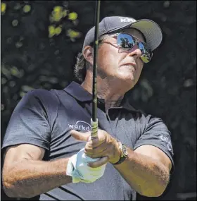  ?? David J. Phillip The Associated Press ?? Phil Mickelson, newly 50, has no plans on playing the Champions Tour anytime soon, not while he’s averaging drives of 301.4 yards.