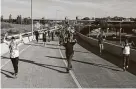  ?? Stephen Maturen / Getty Images ?? Protesters march down a highway off-ramp last week on their way to Minneapoli­s. The city has seen violent protest over George Floyd’s death.