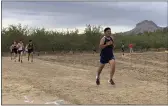  ?? STEVE ALLARD/CONTRIBUTE­D ?? Gridley High’s Emmanual Martinez runs just before the mile marker Sept. 6, at the Butte Valley League race at the Sutter Buttes in Sutter County.