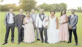  ??  ?? Mr and Mrs Clayton Brown with the groom’s family (from left) nephew Damario Robinson, parents Everol and Jean Brown, brother Damien, sister Duedrops Brown and nephew Franz Williams