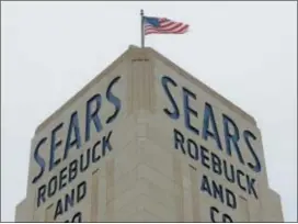  ?? SETH WENIG — THE ASSOCIATED PRESS FILE ?? An American flag flies above a Sears store in Hackensack, N.J.